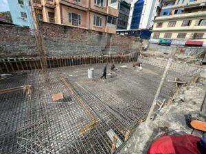 Raft foundation reinforcement work at an ST Builders residential construction project in Kathmandu.