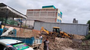 Site preparation work in progress with JCB excavation for an ST Builders construction project in Chabahil, Kathmandu.