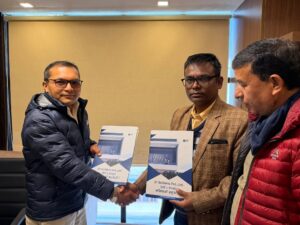 ST Builders team handing over the construction agreement and project documents to a client in Nepal.