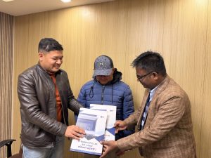 ST Builders Managing Director Mr. Sunil Thakur handing over a contract agreement to a client.