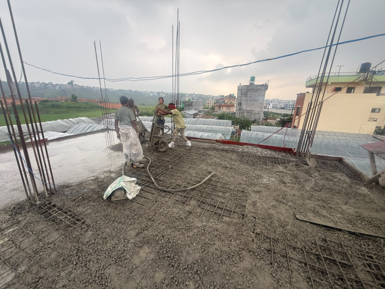 ST Builders residential house construction site in Harisiddhi, Lalitpur during RCC slab casting.