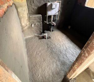 Bathroom waterproofing work in progress at ST Builders residential construction site in Sanepa, Lalitpur.